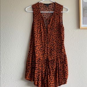 Leopard romper with built in shorts and pockets .